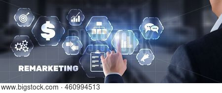 Remarketing Digital Marketing Concept. Businessman Presses Remarketing On Virtual Screen