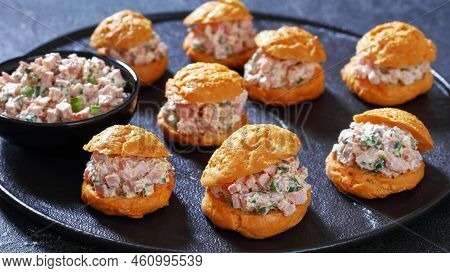 Ham Salad Serving It Sandwiched Between Airy Gougeres, Cheese Puffs On Black Stone Tray, Horizontal 