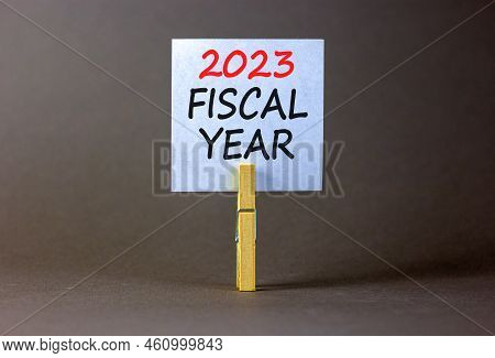 2023 Fiscal Year Symbol. White Paper With Words 2023 Fiscal Year, Clip On Wooden Clothespin. Beautif