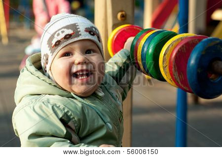Baby Playing With Colored Bright Abacus On