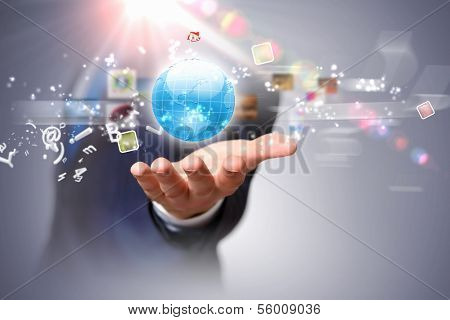 Image of globe on palm of businessman. Media technologies