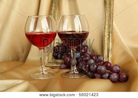 composition of frame,wine and grapes on bright background