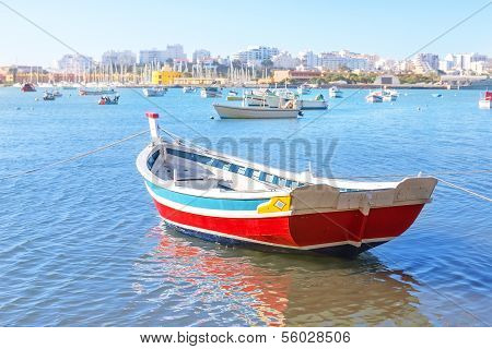 Fishing Boat In The Bay Of Ferragudo Village Summer. Portugal.