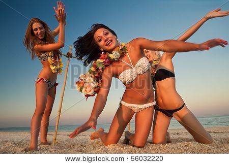 Vacationers have fun doing the limbo