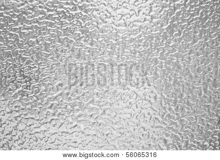 Frozen drops of water on glass