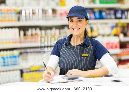 pretty female hardware worker working inside store