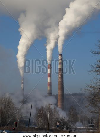 Smoking Pipes On A Background Of The  Blue Sky