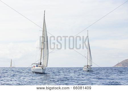 AEGEAN SEA, GREECE - APR 27, 2014: Unidentified sailboats participate in sailing regatta 