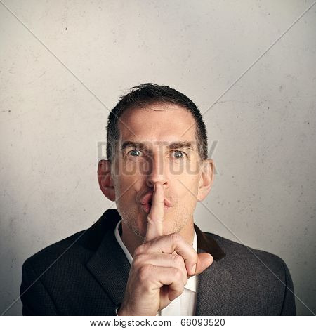 Adult businessman saying 