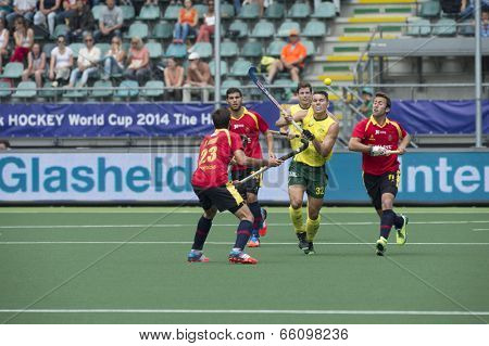 THE HAGUE, NETHERLANDS - JUNE 2: Australian Hayward lifts his stick to control a high ball, surrounded by Spanish players during the Hockey World Cup 2014. AUS beats SPA 3-0