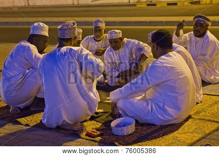 Arabi Men Play Cards at night