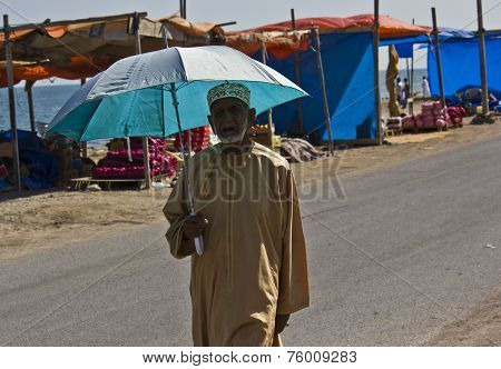 Arab Man with an umbrella