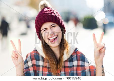 Young woman making peace sign 