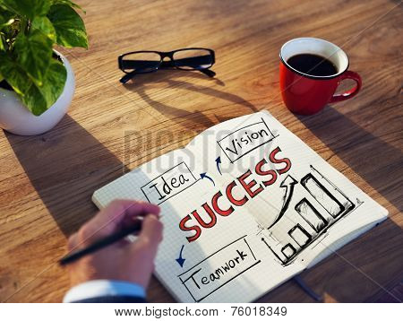 Man with a Note Pad and Success Concepts