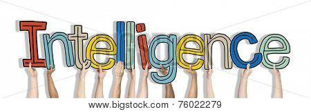 Group of Hands Holding Intelligence Word Concept