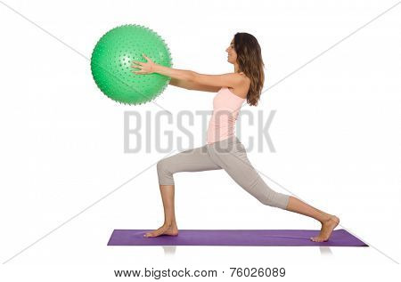 Young woman exercising with swiss ball
