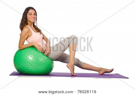 Young woman exercising with swiss ball