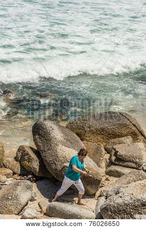 Woman On The Rocks
