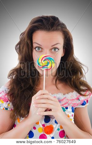Woman with lollipops isolated on white
