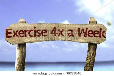Exercise 4x a Week sign with a beach on background
