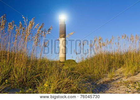 Oak Island Southport North Carolina Lighthouse through the Casswell Beach seagrass at sunset