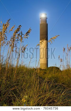 Oak Island Southport North Carolina Lighthouse through the Casswell Beach seagrass at sunset