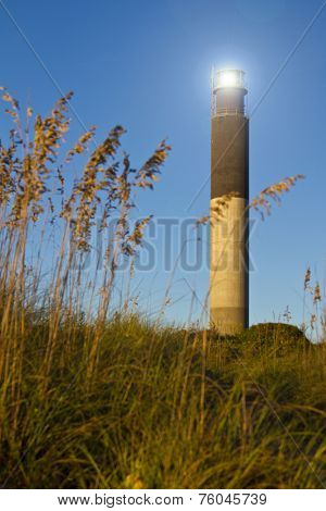 Oak Island Southport North Carolina Lighthouse through the Casswell Beach seagrass at sunset