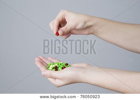 Pills In Women Hand