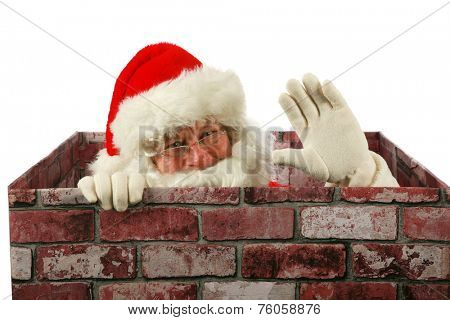 Santa Claus waves at you the viewer while in a Chimney delivering presents to good boys and girls around the world. Santa enters your house through your chimney with the help of his Christmas Magic.