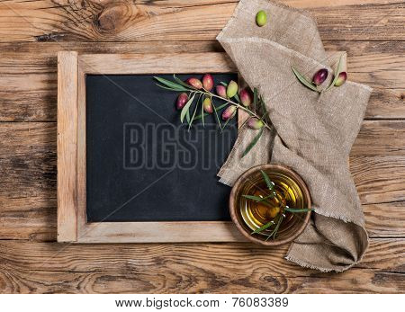 Olives And Olive Oil With Menu Board - Rustic Setting