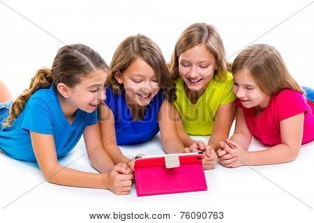 sisters cousins kid girls with tech tablet pc playing happy lying on white background