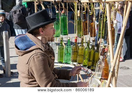 Helsinki,finland-march 29: The Street Musician Plays On Empty Bottles Helsinki,