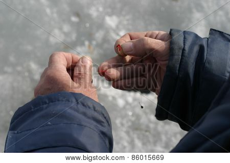 Hand With A Fishing Bait