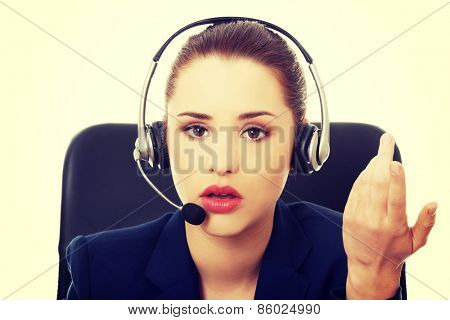 Portrait of anoyed support phone operator in headset