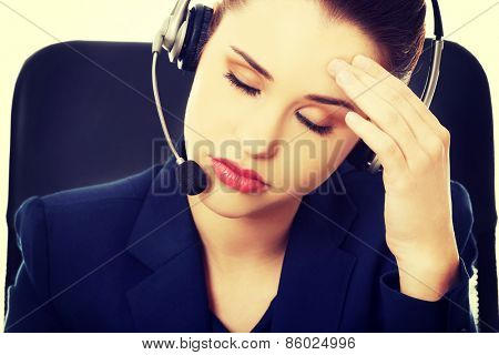 Portrait of anoyed support phone operator in headset