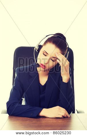Portrait of anoyed support phone operator in headset