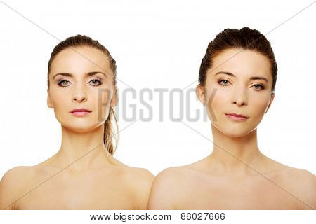 Two attractive topless sisters with make up.