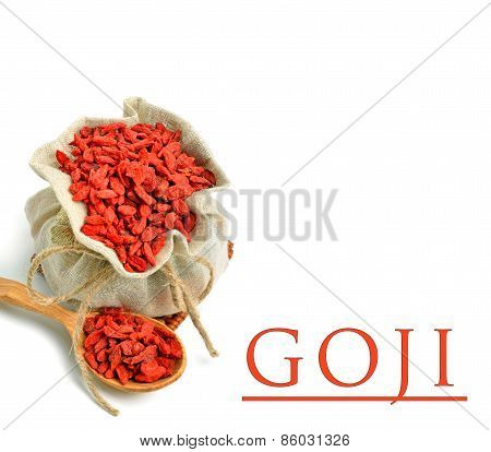 Goji Berries In The Sack Bag With Wooden Spoon Isolated