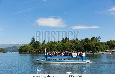 Bowness on Windermere Lake District England UK visitors enjoying tourist attractions like boat trips