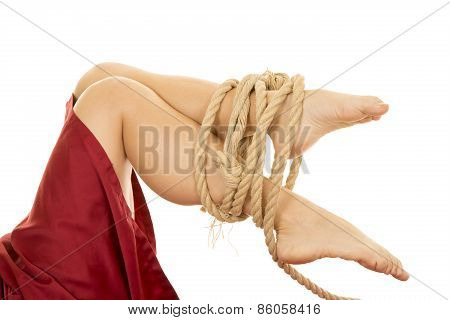 Woman Legs With Red Sheet Tied With Rope Feet Knees Bent
