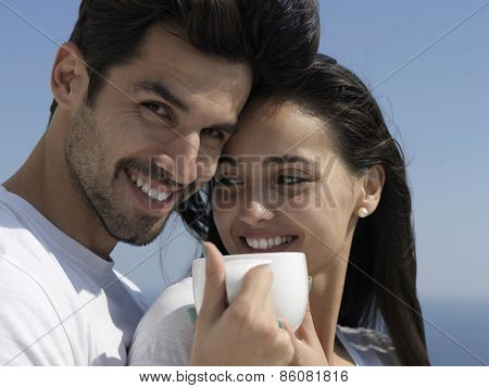 happy young romantic couple have fun relax smile at modern home outdoor terace balcony terace