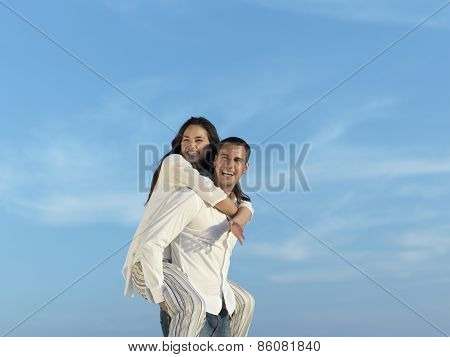 happy young romantic couple have fun relax smile at modern home outdoor terace balcony terace