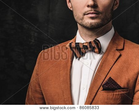 Sharp dressed fashionist wearing jacket and bow tie