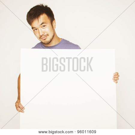 pretty cool asian man holding empty white plate smiling