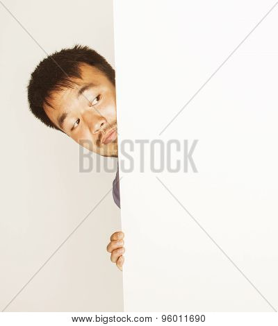 pretty cool asian man holding empty white plate smiling