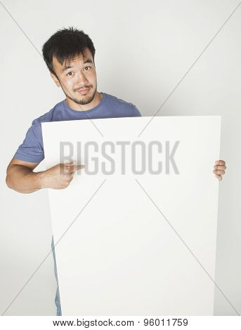 pretty cool asian man holding empty white plate smiling