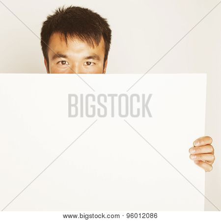 pretty cool asian man holding empty white plate smiling