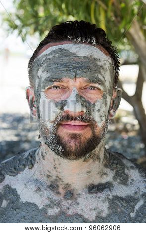 SULTANIYE, TURKEY - JULY 05, 2015: Man taking a mud bath
