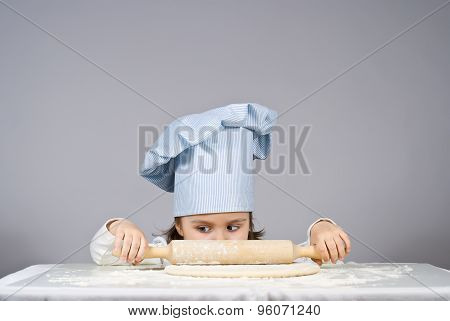 Beautiful Little Girl Cooking Pizza Over Gray Background