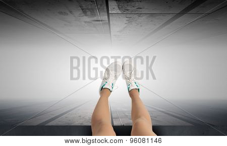 Woman standing on the edge of the roof